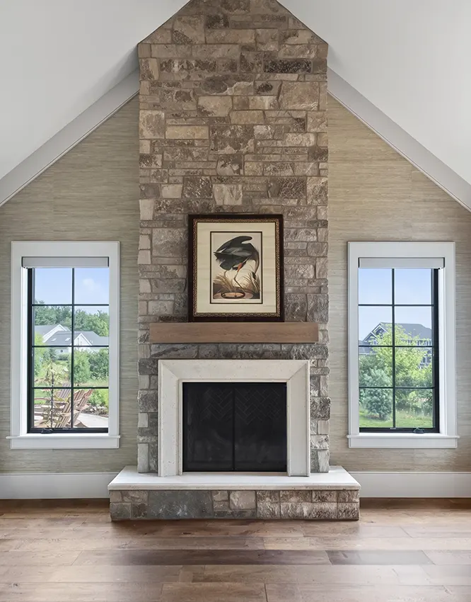 Primary bedroom with floor-to-ceiling fireplace