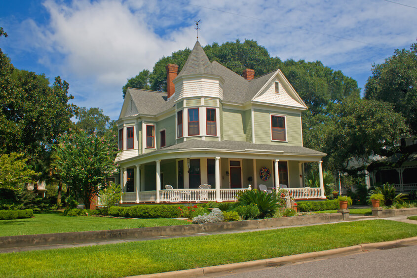 green victorian style home
