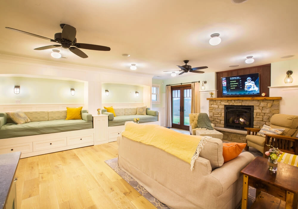 packers-themed-basement-22 - After – Family room with stone fireplace