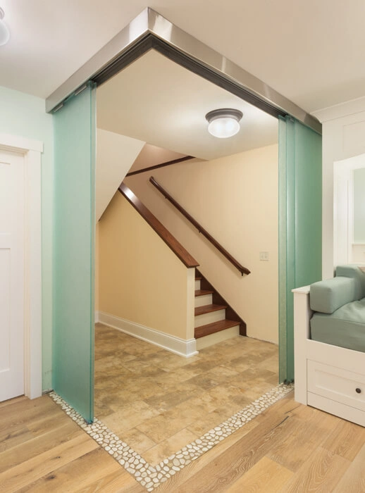 packers-themed-basement-23 - After – Vestibule with stone tile border