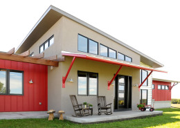 industrial style home with red and gray siding