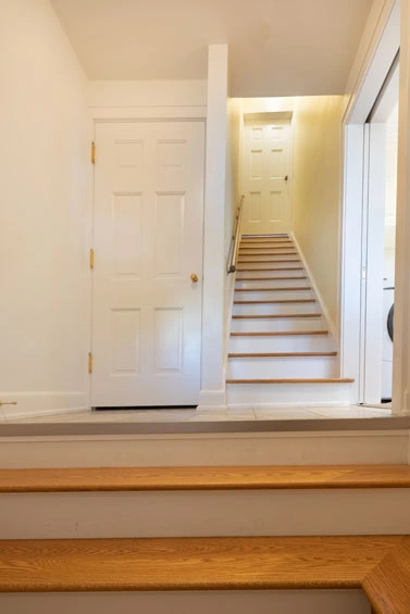 madison-home-design38 - After – Basement stairs moved back, wider entry stairs and landing