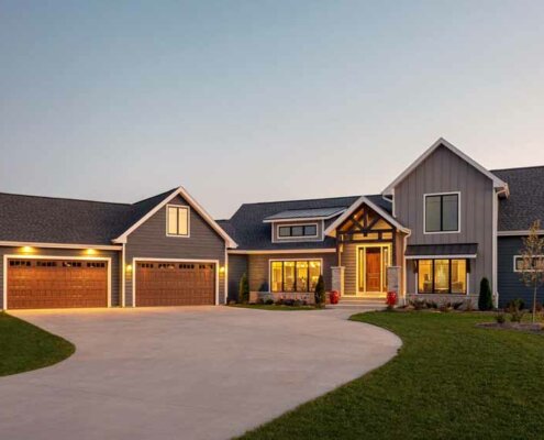 traditional hybrid style home at dusk