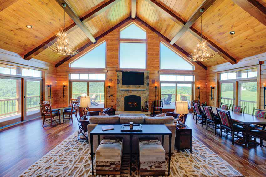 log home great room with large windows