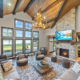 great room with vaulted tongue and groove ceiling and timber beams