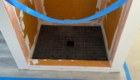 black shower pan tile in dog wash