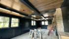 rustic game room with tongue and groove ceiling