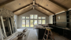 great room with tongue and groove ceiling and large window wall