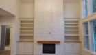 fireplace wall with shiplap and timber mantle