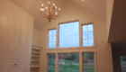 vaulted great room with chandelier