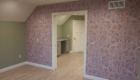 bonus room with wallpaper