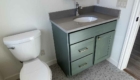 bathroom with green vanity