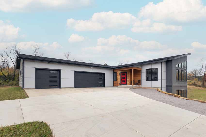 mid-century modern style home with 3 car garage