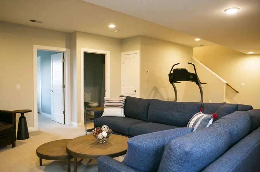 Basement-Remodel-After - After – Family room, bedroom, bathroom and stairs