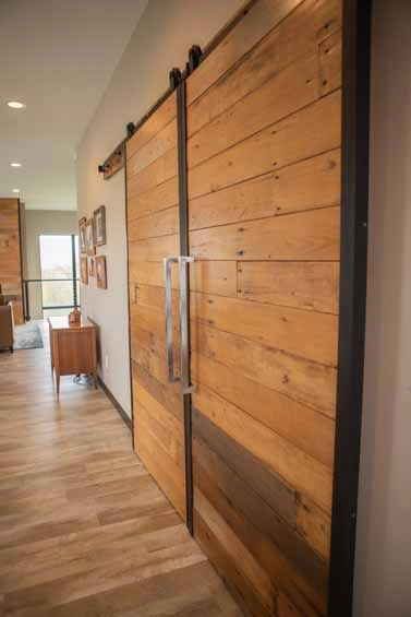 modern-home-builders17 - Sliding Barn Doors to Pantry and Laundry