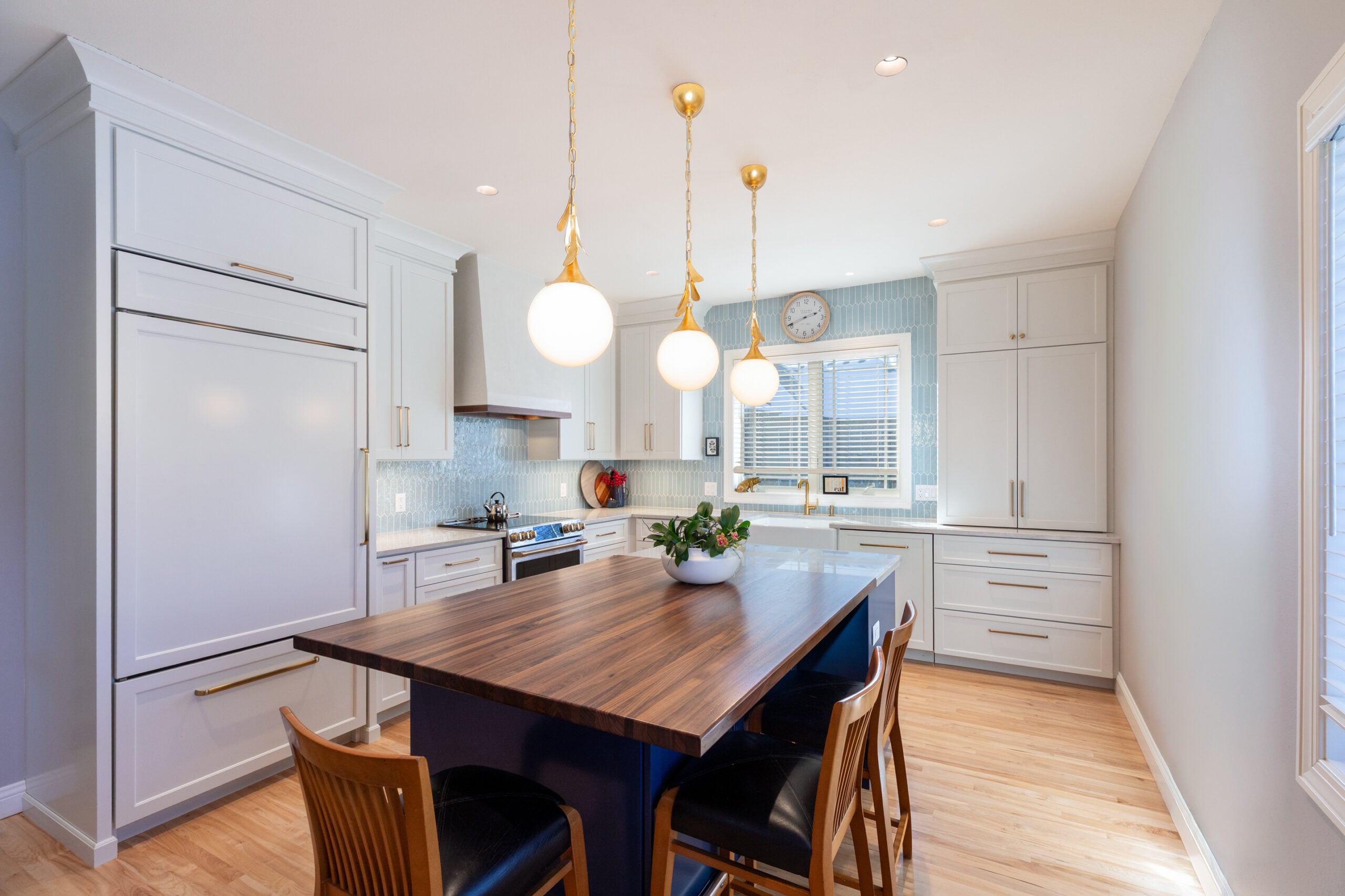 kitchen remodel with white and navy cabinetry
