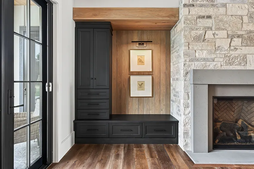 Built-in cabinetry and vertical wood-plank accent wall