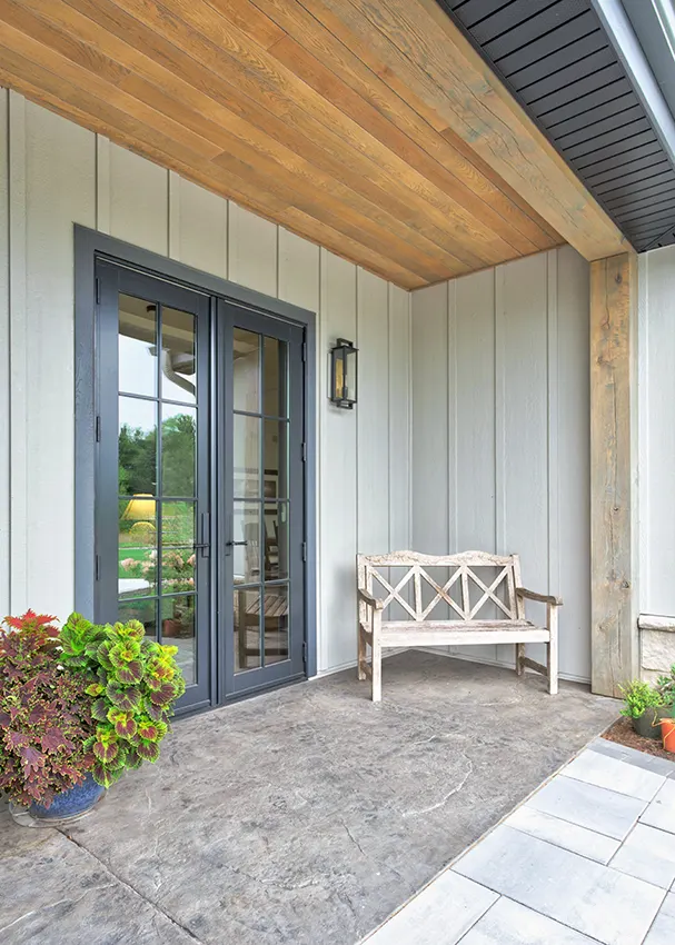 covered patio, where white oak timber beams showcase a Minwax Oyster Gray finish.