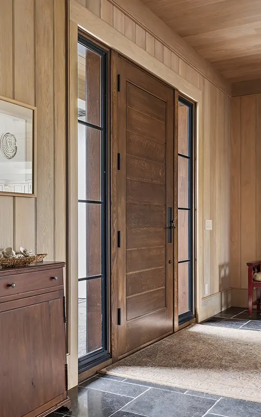 Foyer with custom wood front door