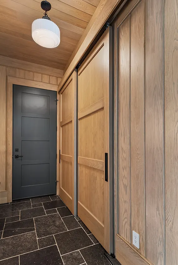 Mudroom with sliding barn doors and closet