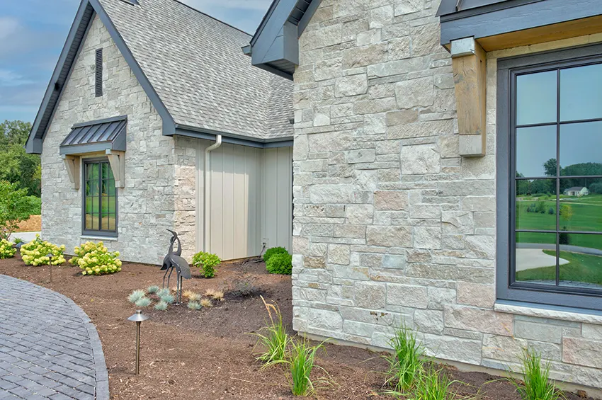 stone facade features Quarry Gray board-and-batten siding
